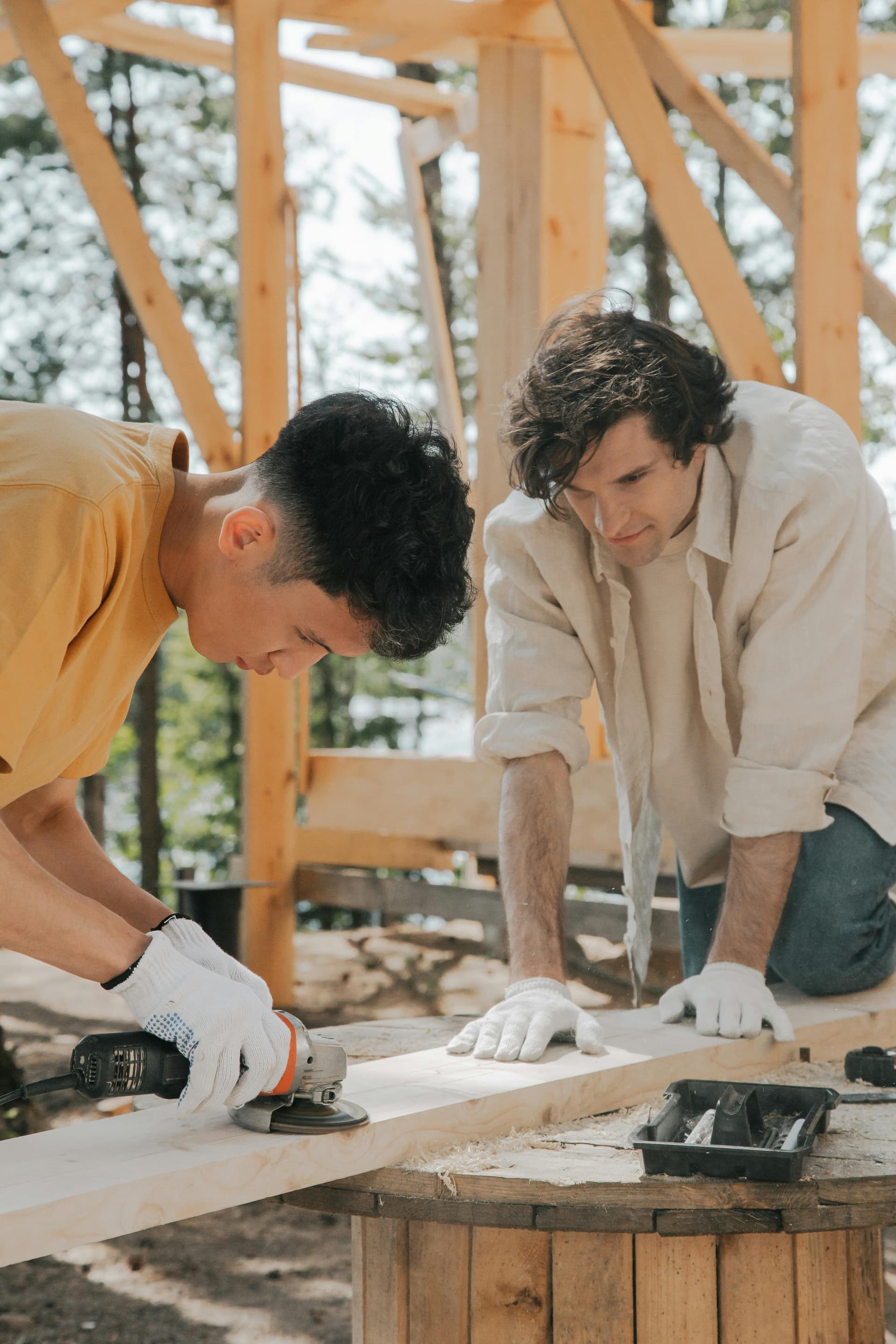 Two tradespeople collaborating on a woodworking project